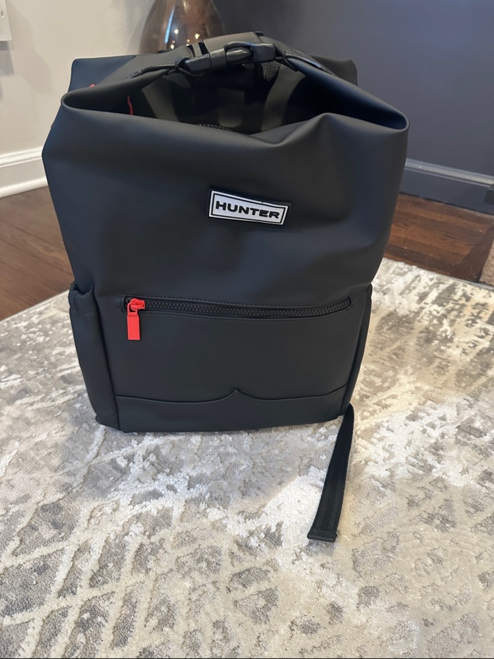 Hunter Black Roll-Top Backpack with Red Zipper Pull